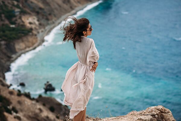 beautiful-young-woman-beach-portrait-attractive-brunette-girl-with-long-hair-posing-rocky-beach-against-background-sea-vacation-sea-copy-space.jpg