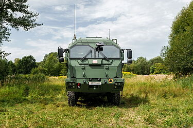 HIGH-PAYLOAD, HIGH-MOBILITY CONTAINER CARRIER